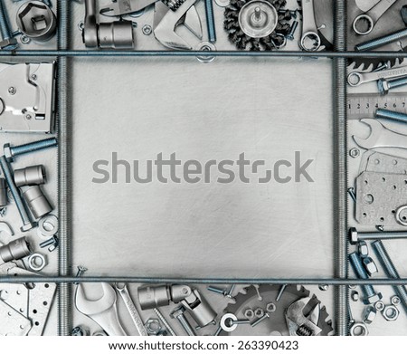 Metal working tools. Metal style. Metal frame and many working tools on the scratched metal background.