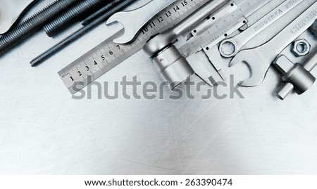Metal working tools. Metal style. Metal tools on the scratched metal background.