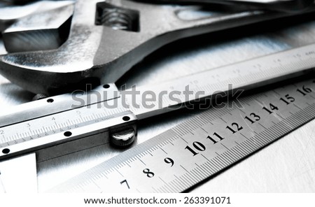 Metal tools. Metal style. Many metal tools on the scratched metal background.