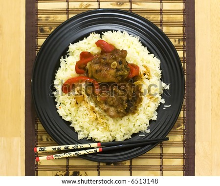 Asian style of food with chopsticks and small wood tablecloth