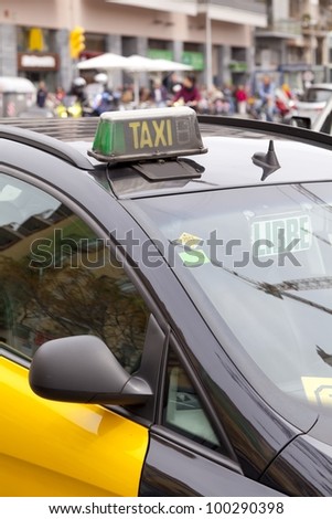 Typical taxi yellow and black in Barcelona, Spain