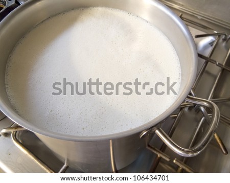 Industrial pot boiling fresh milk for consumption