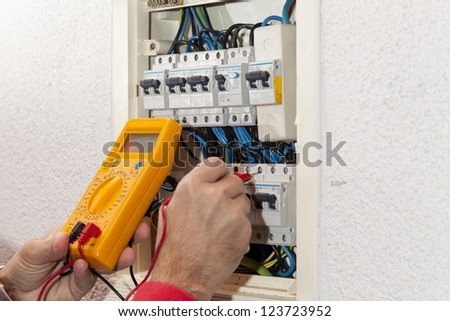 Electrician doing some checks on a light box