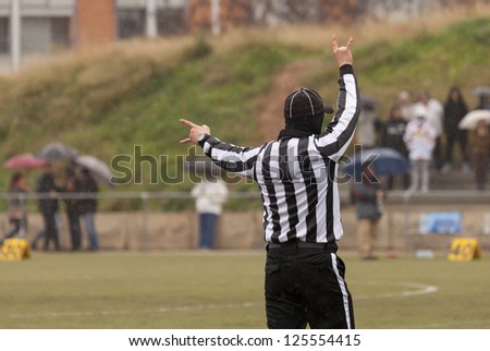 Closeup of the back of a football referee
