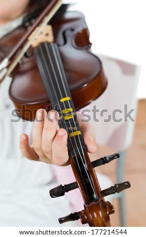Prodigy playing the violin in the school of music