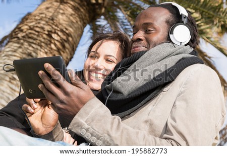 Lovers listening to music in the park