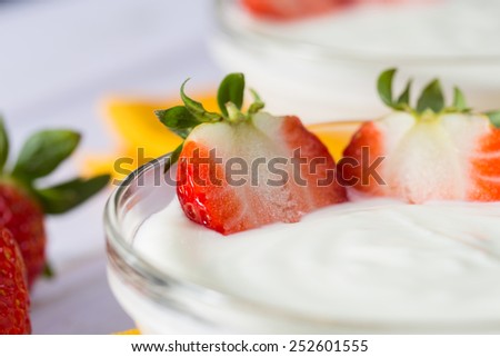 Plain yogurt with delicious fresh strawberries