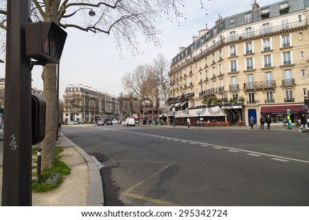PARIS, FRANCE - MARCH 13: Tourists walk past a cafeteria and souvenir store on March 13, 2015 in Paris. Paris is the most visited city in the world.