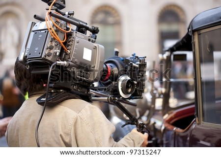Television camera recording a scene from a movie