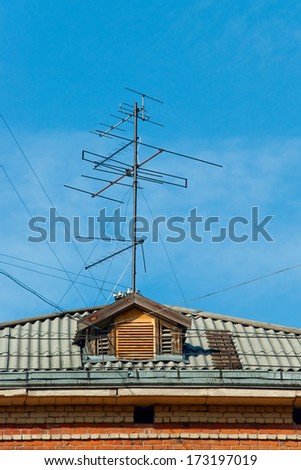 TV antenna mounted on a roof house