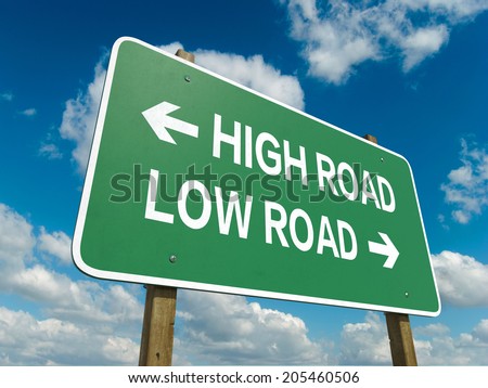 A road sign with high road low road words on sky background