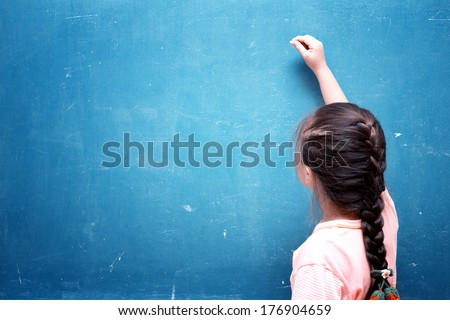 Girl Drawing On Blank Chalkboard