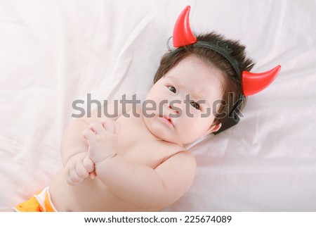 little baby funny with devil horns