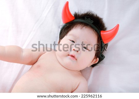little baby funny with devil horns