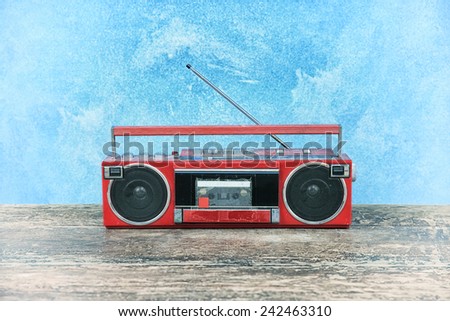 old retro radio on table blue background