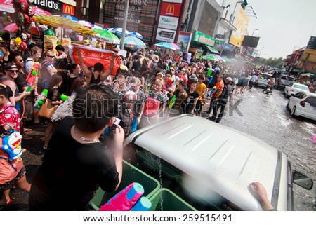 CHIANG MAI THAILAND-APRIL 13:Chiang mai Songkran festival. Foreign tourists and Thai people enjoy splashing water. on April 13,2014 in Chiang mai,Thailand.
