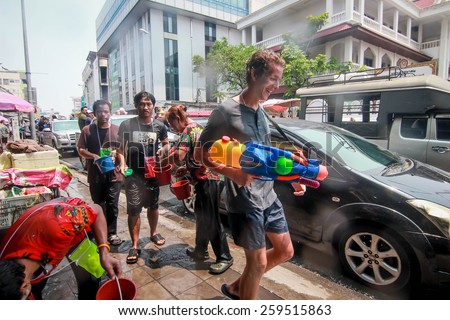 CHIANG MAI THAILAND-APRIL 13:Chiang mai Songkran festival. Foreign tourists and Thai people enjoy splashing water. on April 13,2014 in Chiang mai,Thailand.