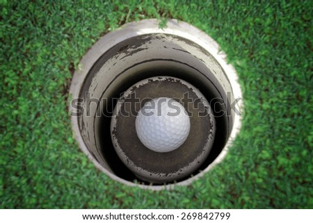 golf ball in the hole