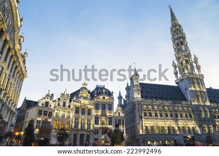 Wide angle night scene of the Grand Place, the focal point of Brussels, Belgium. The Town Hall (Hotel de Ville) is dominating the composition with its 96m tall spire