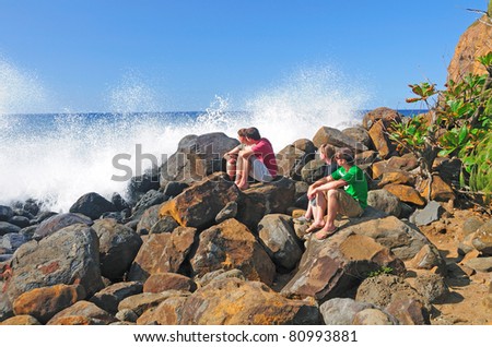 People watching the waves crash on the North Coast of the Big Island of Hawaii
