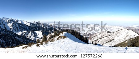 Panorama of Snowy winter in mountain forest. Amazing place for activity extreme sport and climbing in Almaty, Kazakhstan, Asia