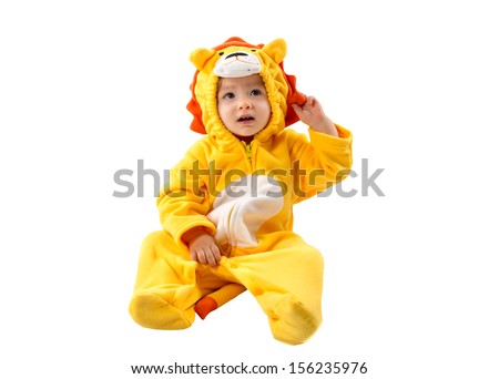Child girl,dressed in lion carnival suit, isolated on white background. Baby zodiac - sign Leo. The concept of childhood and holiday