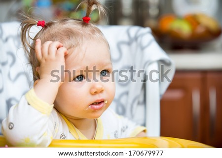 Portrait of child girl on kitchen. Use it for child, healthy food, infant formula concept