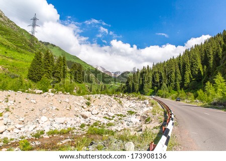 Road on Big Almaty Lake, nature green mountains and blue sky in Almaty, Kazakhstan,Asia at summer