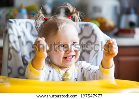 Portrait of child girl on kitchen. Use it for child, healthy food, infant formula concept
