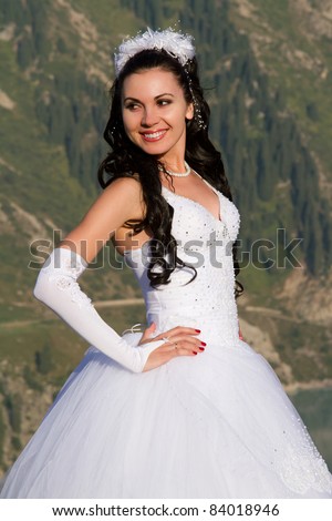 smiling bride  in the mountains