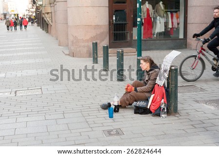 HELSINKI, FINLAND - MARCH 29:the refugee begs on the street of Helsinki,\
FINLAND-MARCH 29 2014.On streets of the cities of Finland the refugees begging meet.