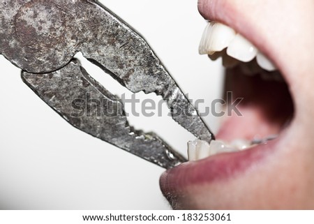 extractions with pliers on white background