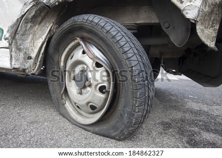 wrecked car tyre on the road
