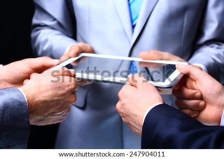 Modern people doing business  being demonstrated on the screen of a touch-pad