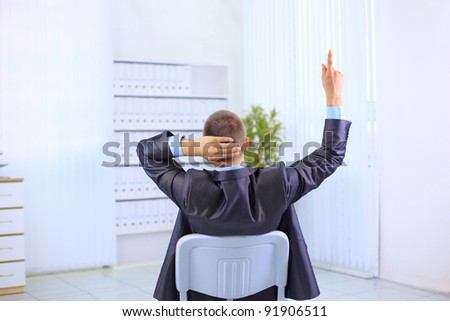 Business man leaning back in the chair , have an idea on white background