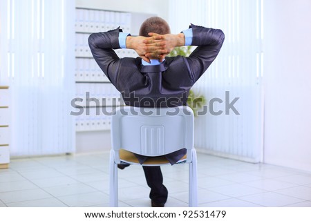 Business man leaning back in the chair , have relaxing on white background