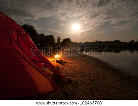 tent and campfire at night