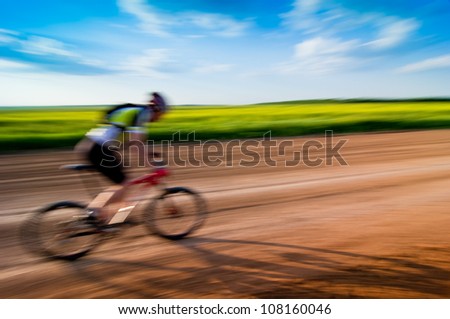 man extreme biking in motion