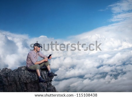 man working outdoors with tablet pad