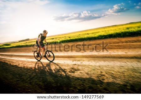 man extreme biking in motion
