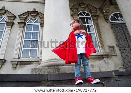 a girl acting like a super hero