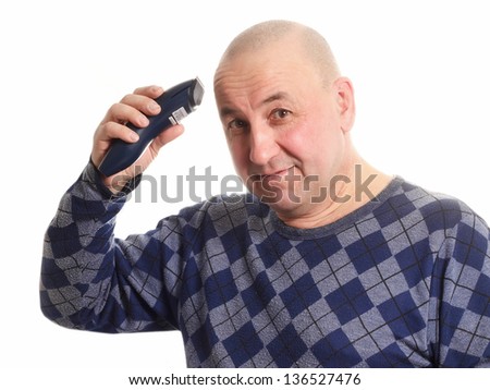 Middle aged man shaving with electric shaver, isolated on white background