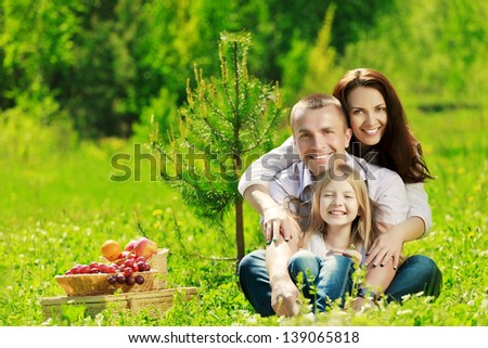 Happy Family At Picnic On The Summer Meadow