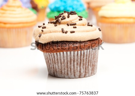 Chocolate peanut butter cupcake, photographed on a white background.