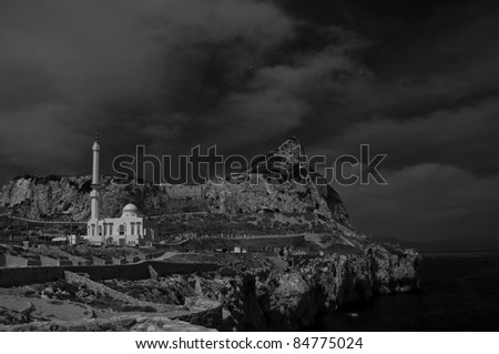 A black and white image of the Mosque with the rock of Gibraltar in the background