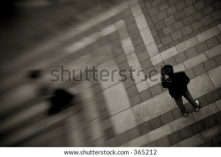 A man watches as a beautiful women walks away.