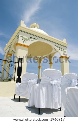 stock photo Wedding Gazebo in Mexico with white chair covers