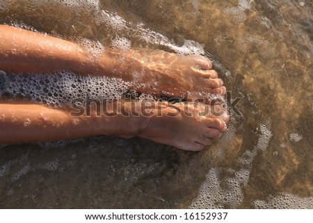 woman feet relax on the beach