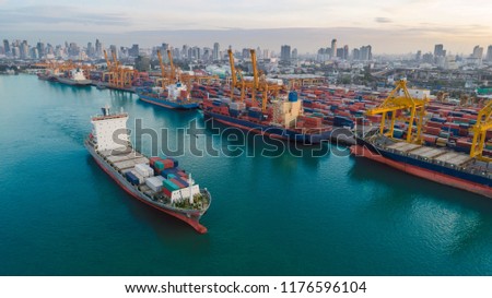 Container ship from sea port working for delivery containers shipment and container warehouse background. Suitable use for transport or import export to global logistics concept.