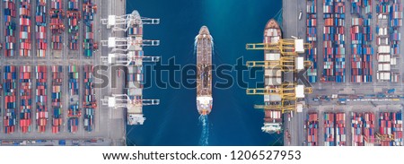Aerial view panoramic oil tanker moving pass sea port warehouse and container ship or crane ship working for delivery containers shipment.